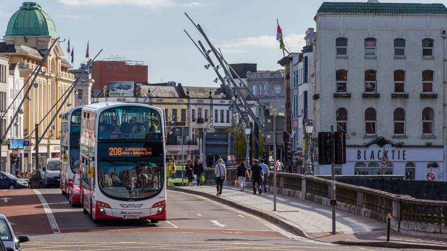 Bus Éireann double-decker buses crossing St Patrick's Bridge over the River Lee in central Cork