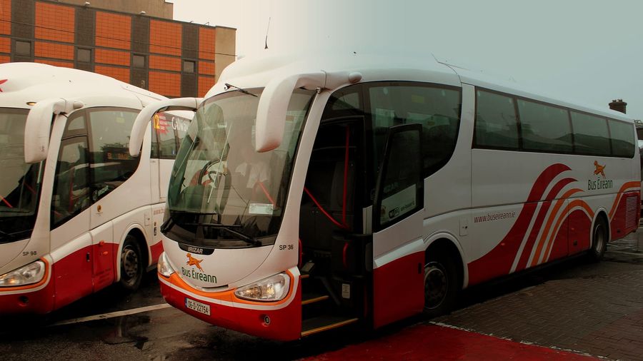 Bus Éireann Irizar coaches lined up at Galway's combined bus and railway station beside Eyre Square, one showing Galway on its destination board