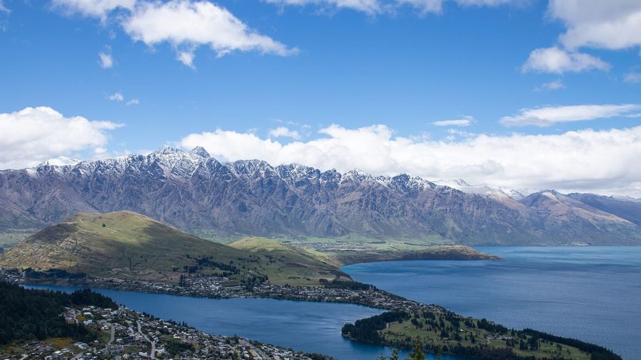 The jagged Remarkables mountain range rising above the blue water of Lake Wakatipu near Queenstown, New Zealand
