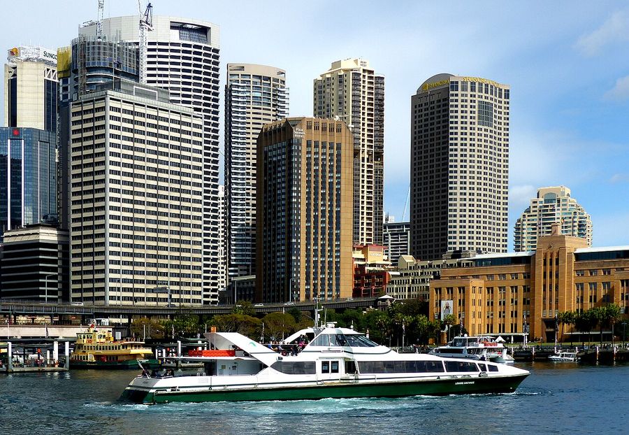 A Sydney RiverCat ferry pulling into Circular Quay, the harbourside hub where many of the city's guided tours begin